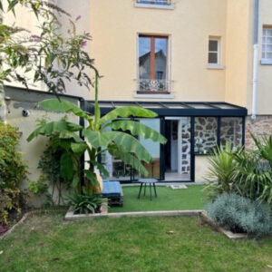 Rénovation d'une extension avec une véranda Weisz